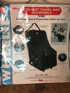 lot 730 image: Baby seat  carrier. Great for traveling as wheels  hiugh dollar item
