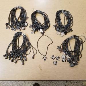 lot 13 image: approximately 75 hematite necklaces - bear and Thunderbird pendants
