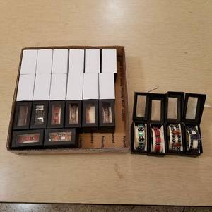 lot 82 image: 24 assorted bracelets in display boxes