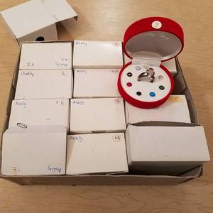 lot 83 image: 12 colors of life rings in boxes - assorted sizes - marked sterling silver