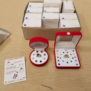 lot 88 image: 12 colors of life rings- assorted sizes - marked sterling silver