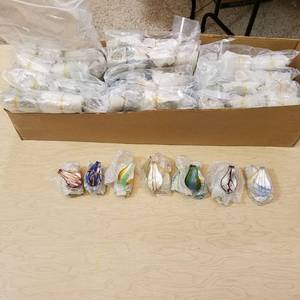 lot 106 image: approximately 600 large glass jewelry pendants