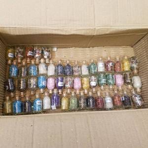 lot 109 image: approximately 50 small bottles of assorted gems