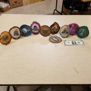 lot 142 image: approximately 40 polish geodes with figurines affixed to them