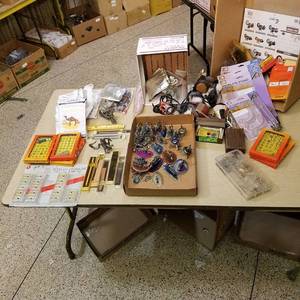 lot 171 image: large lot of assorted miscellaneous items - watch bands, keychain lasers, eyeglass repair kits, clear plate stands, Etc