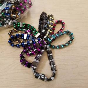 lot 185 image: Case of 500 hematite bracelets - 10 assorted colors