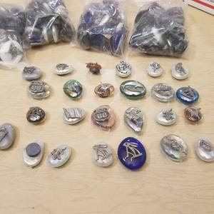 lot 207 image: approximately 120 assorted figurines on polished stones