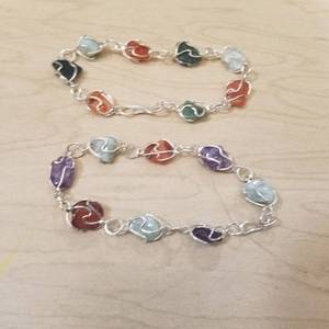 lot 215 image: approximately 85 bracelets