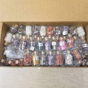 lot 218 image: well over 100 small bottles of assorted gemstones