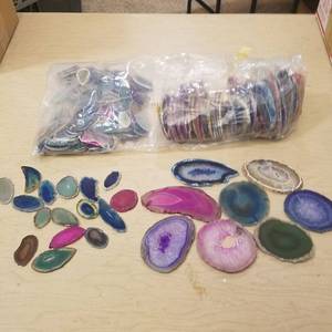 lot 222 image: approximately 150 polished flat geodes - approximately 100 smaller ones, approximately 50 larger ones