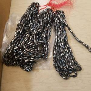 lot 234 image: over 250 strands of 6 by 12 millimeter faceted rice jewelry beads