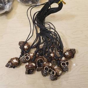 lot 240 image: approximately 100 skull necklaces