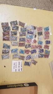 lot 2077 image: Approx 51 packages of Cloisonne Beads- Round and Small Crosses