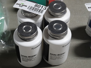lot 8013 image: 4 containers of Skin-Bond