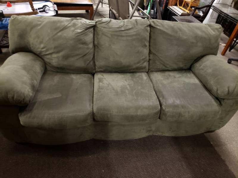 olive green reclining sofa