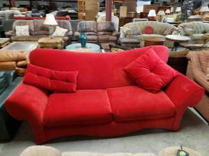 lot 1009 image: Cherry Red Sofa - Model Home Display
