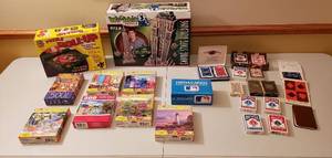 lot 4370 image: Lot of Puzzles & Playing Cards - Wrebbit 3D Puzzle of Empire State Building, Puzzle Roll-up, 7 Puzzles, Golden Trivia Cards MLB, 9 Sets of Playing Cards, 2 Twin Sets and Score Pads