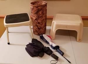 lot 4378 image: Lot of 2 Step Stools (Costco MetalPlastic one), 3 Fold up Umbrellas and Basket Weave Umbrella Holder