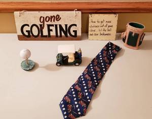 lot 4379 image: Lot of Golf Items - Signs, Tie, Golf Kart Display and other Items
