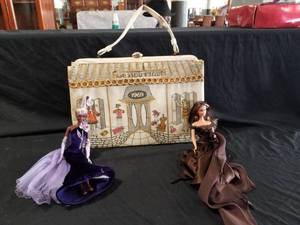 lot 7557 image: Boutique 1969 Handbag and 2 Barbies in Evening wear