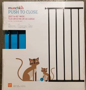 lot 219 image: Munchkin Push to Close Extending Metal Baby Gate, Black