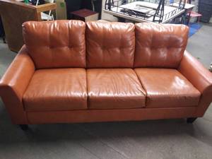 lot 2513 image: 2700238 Ashley Furniture Paulie Durablend - Orange Sofa