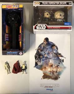 lot 1098 image: Collection of Star Wars Figures, Funko Pop, Large Darth Vader Pez Dispenser, and Rogue One Movie Poster