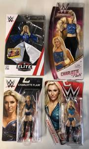 lot 1101 image: Four WWE New In Package Charlotte Flair Wrestling Figures