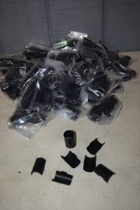 lot 385 image: 36 Packages of 4 Metro Shelf Shelf Stoppers