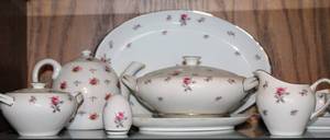 lot 2307 image: Assorted Rosechintz by Meito China, 1 Serving Platter, Lidded Serving Bowl, Teapot with Lid, Gravy Boat, Sugar and Creamer Servers, 1 Salt Shaker, Tea Pot Stamped 25170