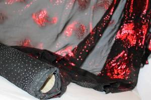 lot 2318 image: Spool of Fabric, Sheer Black with Red Metallic PaisleyFlower Design