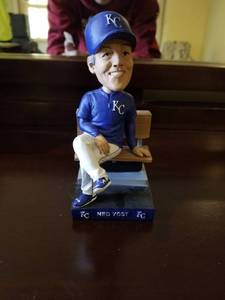 lot 5324 image: Ned Yost Bobble Head Sitting on Bench