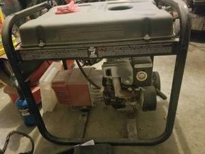 lot 5663 image: Coleman Powermate Generator
