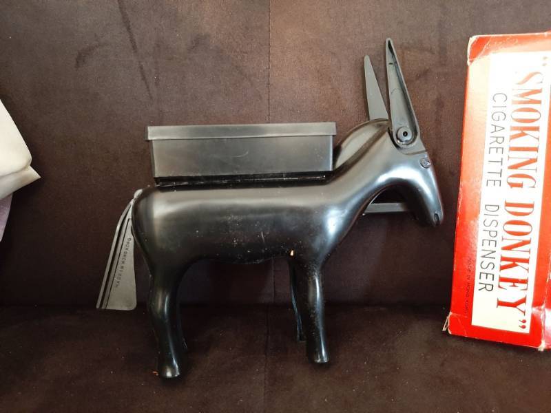 smoking donkey cigarette dispenser Smoking Donkey cigarette dispenser | Cheney KS Estate Auction - '89 Lincoln  Town Car, Budweiser Steins, Tools, New Housewares and Furniture - Lift  Chair, Bedroom sets, China Cabinet