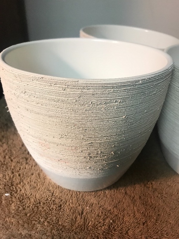 lot 1052 image: Four new ceramic pots textured on outside smooth glaze surface on inside