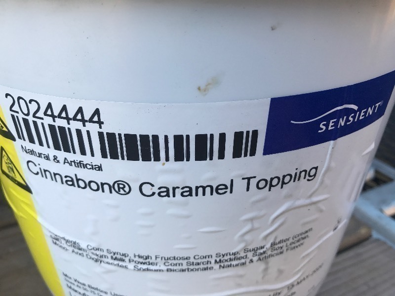 lot 339 image: 20 pound bucket of Cinnabon caramel frosting for cinnamon rolls or whatever make your own sticky buns with the Cinnabon caramel sauce best used date 2020