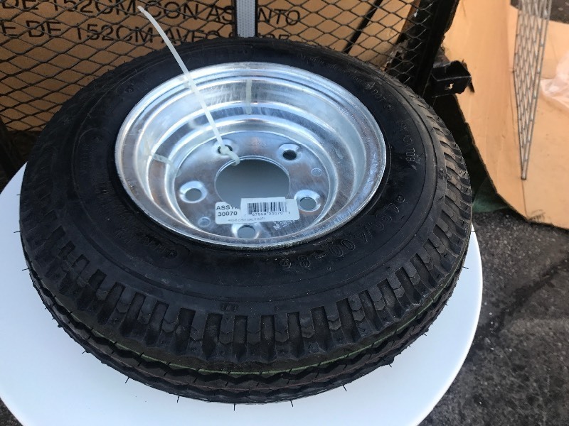 lot 911 image: New tire see picture for size  as pictured