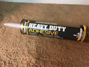 lot 129 image: Lot of six tubes of heavy duty adhesive these are standard size tubes well fit regular size  caulking gun