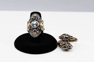 lot 74 image: 2 Silver with Gold Detail Rings - One has 2 dragons