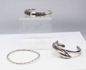 lot 104 image: 3 Silver Bracelets - Dolphin Cuff, Silver Cuff and Silver Bangle