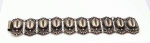 lot 106 image: Sterling Silver Domed Repousse Bracelet  - Stamped with Artists Hallmark
