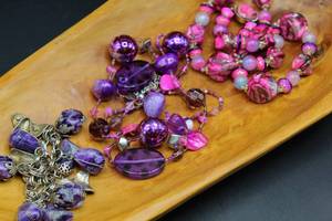 lot 2611 image: 2 Assorted Beaded Glass and Plastic Necklaces and 1 Dangle Bead Bracelet