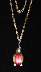 lot 2602 image: 1960s Jeffrey Coccinelle Penguin Pendant Watch 13.5 Chain  2 Timepiece Penguin