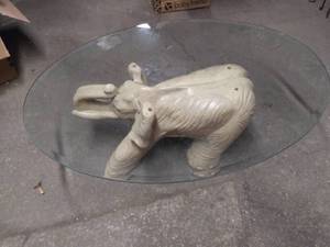 lot 5802 image: Ivory Elephant Coffee Table with Oval Glass Top