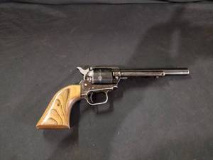 lot 7673 image: Heritage Mfg..22 Mag Pistol w Wood Grips