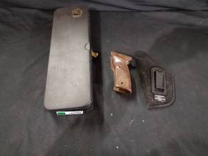 lot 7681 image: Gun Cleaning Kit, Holster, Replacement Grips