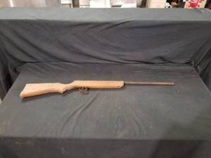 lot 7747 image: Slide Action Wood Stock Gun