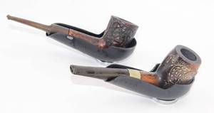 lot 1956 image: VINTAGE 2 BLACK METAL WITH MAGNETIC BOTTOM PIPE HOLDERS