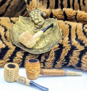 lot 1949 image: 3 VINTAGE CORNCOB PIPES IRC, H&B, AND CORN PALACE AND HAMPTON BRASS ASHTRAY DEPICTING LEAF AND BERRIES