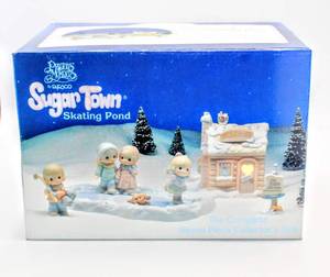 lot 2340 image: Precious Moments Sugar Town Skating Pond 7 Piece Collectors Set